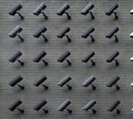 Close-up of surveillance cameras covering a commercial site