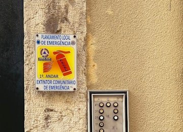Touchscreen access control keypad mounted at a secured building entrance
